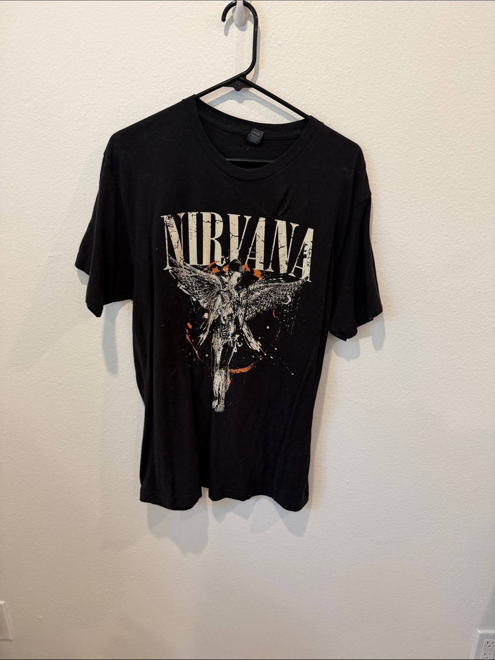 NIRVANA Black Tee with White Angel Graphic and Orange Accents